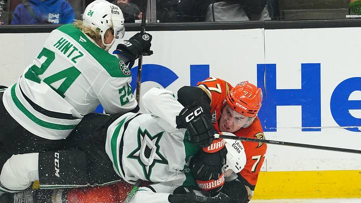 Dec 19, 2025; Anaheim, California, USA; Anaheim Ducks right wing Frank Vatrano (77) grapples with Dallas Stars left wing Jason Robertson (21) and center Roope Hintz (24) in the third period at Honda Center. Mandatory Credit: Kirby Lee-Imagn Images Dec 19, 2025; Anaheim, California, USA; Anaheim Ducks right wing Frank Vatrano (77) grapples with Dallas Stars left wing Jason Robertson (21) and center Roope Hintz (24) in the third period at Honda Center. Mandatory Credit: Kirby Lee-Imagn Images