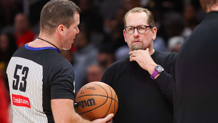 Oct 14, 2024; Atlanta, Georgia, USA; Philadelphia 76ers head coach Nick Nurse talks to referee Matt Kallio (53) against the Atlanta Hawks in the third quarter at State Farm Arena. Mandatory Credit: Brett Davis-Imagn Images