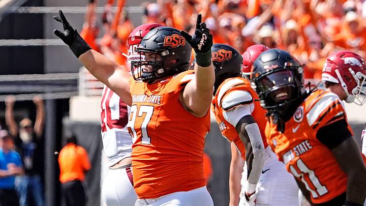 Oklahoma State's Justin Kirkland (97) celebrates a missed field goal by Arkansas in the first over time of the college football game between the Oklahoma State Cowboys and the Arkansas Razorbacks at Boone Pickens Stadium in Stillwater, Okla.,, Saturday, Sept., 7, 2024.