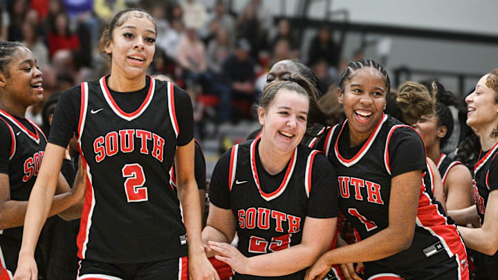 Westerville South's Deziah Dupree (left), Laynie Gibbs and Atang Fontem celebrate Jan. 24, 2025, at Big Walnut. (photo by John Hulkenberg)