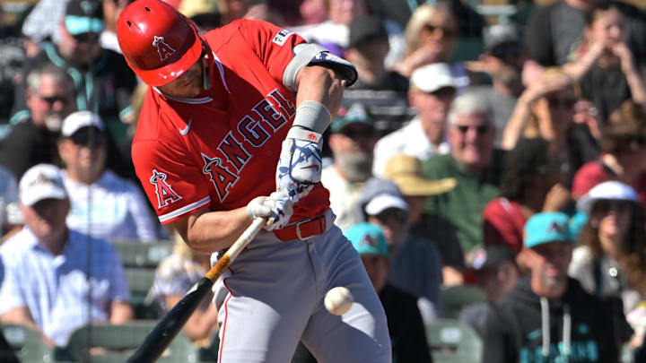 Feb 22, 2026; Salt River Pima-Maricopa, Arizona, USA; Los Angeles Angels right fielder Mike Trout (27) singles in the third inning against the Arizona Diamondbacks at Salt River Fields at Talking Stick. Mandatory Credit: Jayne Kamin-Oncea-Imagn Images