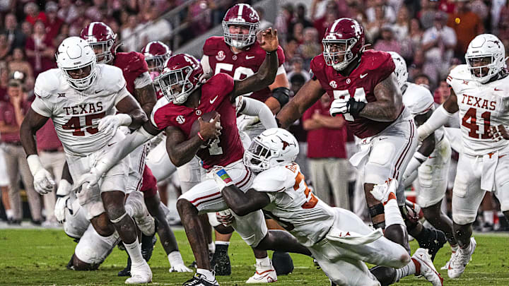 Alabama quarterback Jalen Milroe (4) is sacked by Texas Longhorns linebacker David Gbenda (3) during