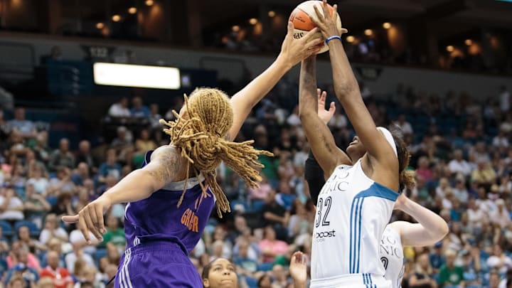 Jun 27, 2015; Minneapolis, MN, USA; Phoenix Mercury center Brittney Griner (42) and Minnesota Lynx forward Rebekkah Brunson (32) rebound in the second quarter at Target Center. Mandatory Credit: Brad Rempel-Imagn Images