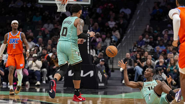 Dec 28, 2024; Charlotte, North Carolina, USA Charlotte Hornets forward Moussa Diabate (14) grabs an errant loose ball and tosses it to forward Miles Bridges (0) for the fast break against the Oklahoma City Thunder during the second half at Spectrum Center. Mandatory Credit: Jim Dedmon-Imagn Images Dec 28, 2024; Charlotte, North Carolina, USA Charlotte Hornets forward Moussa Diabate (14) grabs an errant loose ball and tosses it to forward Miles Bridges (0) for the fast break against the Oklahoma City Thunder during the second half at Spectrum Center. Mandatory Credit: Jim Dedmon-Imagn Images
