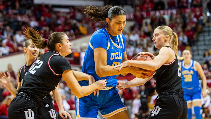 UCLA's Lauren Betts (51) is tied up by Indiana's Lillly Meister (52) and Henna Sandvik (21) during the Indiana versus UCLA women's game at Simon Skjodt Assembly Hall on Saturday, Jan. 4, 2025. UCLA's Lauren Betts (51) is tied up by Indiana's Lillly Meister (52) and Henna Sandvik (21) during the Indiana versus UCLA women's game at Simon Skjodt Assembly Hall on Saturday, Jan. 4, 2025.