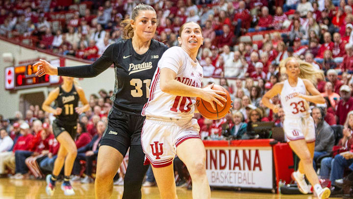 Indiana's Shay Ciezki (10) scores on a fast break in front of Purdue's Sophie Swanson (31) during the Indiana versus Purdue women's basketball game at Simon Skjodt Assembly Hall on Saturday, Feb. 15, 2025. Indiana's Shay Ciezki (10) scores on a fast break in front of Purdue's Sophie Swanson (31) during the Indiana versus Purdue women's basketball game at Simon Skjodt Assembly Hall on Saturday, Feb. 15, 2025.