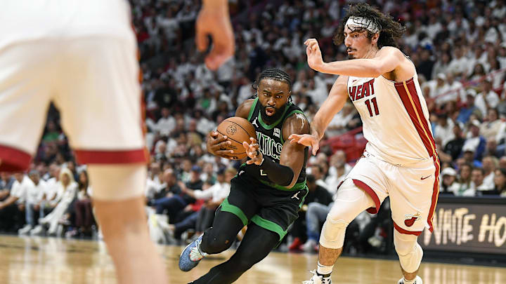 Apr 29, 2024; Miami, Florida, USA; Boston Celtics guard Jaylen Brown (7) drives past Miami Heat guard Jaime Jaquez Jr. (11) during the second quarter of game four of the first round for the 2024 NBA playoffs at Kaseya Center. Mandatory Credit: Michael Laughlin-Imagn Images