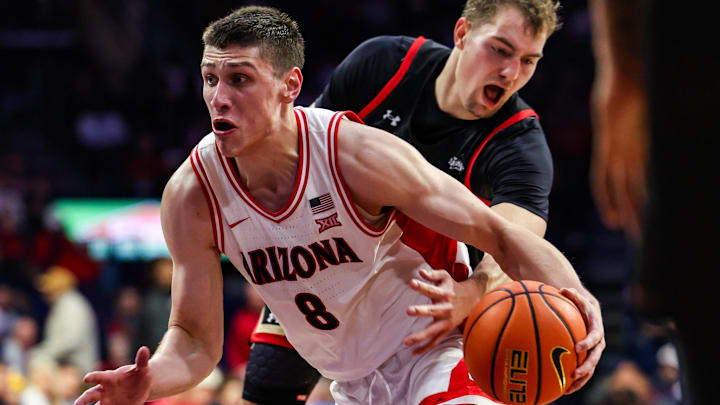 Nov 24, 2025; Tucson, Arizona, USA; Arizona Wildcats forward Ivan Kharchenkov (8) dribbles the ball during the second half of the game against the Denver Pioneers at McKale Memorial Center. Mandatory Credit: Aryanna Frank-Imagn Images