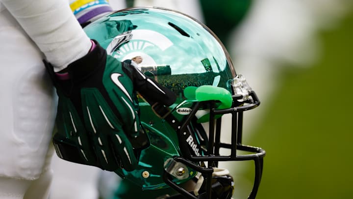 October 20, 2012; Ann Arbor, MI, USA; Michigan State Spartans player hold his helmet during the