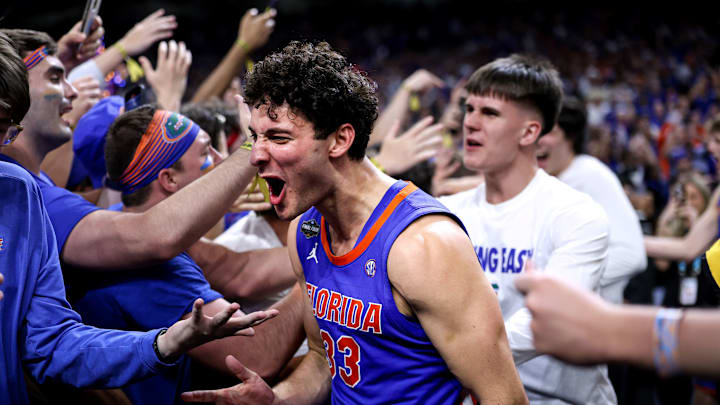 Florida Gators walk-on Cooper Josefsberg celebrates with the Rowdy Reptiles after the team's win over Auburn in the Final Four.