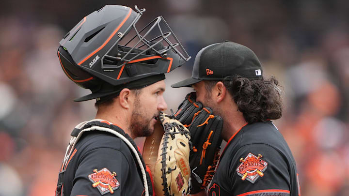 Apr 25, 2026; San Francisco, California, USA; San Francisco Giants catcher Patrick Bailey (left) talks with starting pitcher Robbie Ray (right) during the first inning against the Miami Marlins at Oracle Park. Mandatory Credit: Darren Yamashita-Imagn Images
