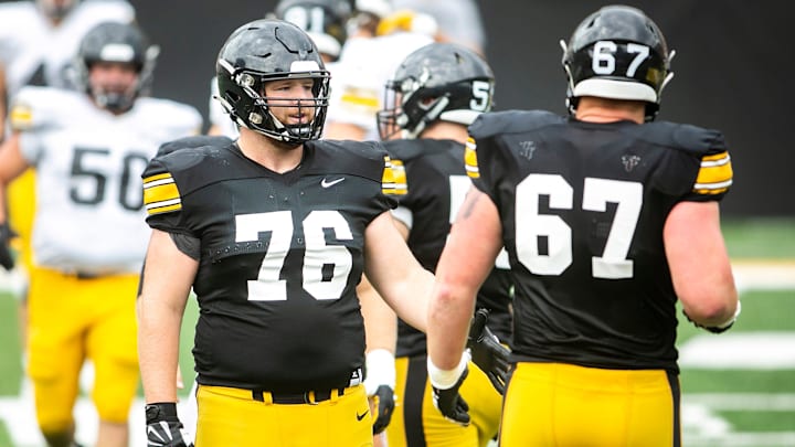 Iowa offensive lineman Tyler Elsbury, left, high-fives teammate Gennings Dunker as they warm up during the Kids Day at Kinnick NCAA football practice, Saturday, Aug. 13, 2022, at Kinnick Stadium in Iowa City, Iowa.

220813 Ia Kids Day Fb 017 Jpg