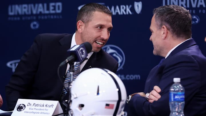 Dec 8, 2025; University Park, PA, USA; Matt Campbell, left, speaks with Penn State University athletic director Pat Kraft, right, while being announced as the Penn State Nittany Lions new head coach during a press conference at the Beaver Stadium Press Room. Mandatory Credit: Matthew O'Haren-Imagn Images Dec 8, 2025; University Park, PA, USA; Matt Campbell, left, speaks with Penn State University athletic director Pat Kraft, right, while being announced as the Penn State Nittany Lions new head coach during a press conference at the Beaver Stadium Press Room. Mandatory Credit: Matthew O'Haren-Imagn Images