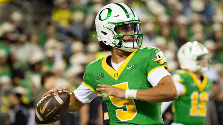 Dante Moore and the Oregon Ducks are home favorites over USC in Week 13 Big Ten action.