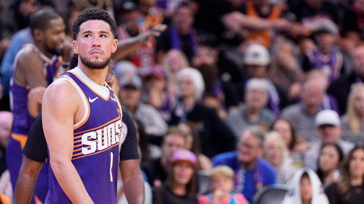 Nov 2, 2024; Phoenix, Arizona, USA;  Phoenix Suns guard Devin Booker (1) reacts after a time out in the second half during a game against the Portland Trail Blazers at Footprint Center. Mandatory Credit: Allan Henry-Imagn Images