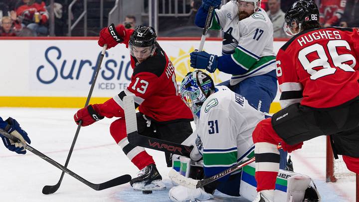Oct 10, 2026; Newark, New Jersey, USA; New Jersey Devils center Nico Hischier (13) takes a shot against the Vancouver Canucks during the second period at Prudential Center. Mandatory Credit: Thomas Salus-Imagn Images Oct 10, 2026; Newark, New Jersey, USA; New Jersey Devils center Nico Hischier (13) takes a shot against the Vancouver Canucks during the second period at Prudential Center. Mandatory Credit: Thomas Salus-Imagn Images