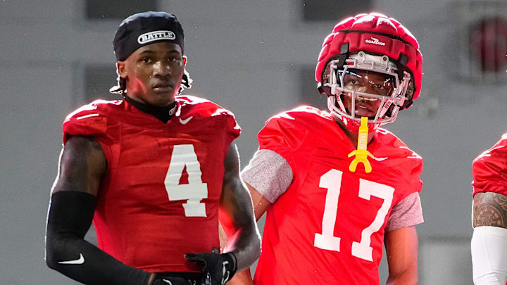 Ohio State Buckeyes wide receivers Jeremiah Smith (4), Carnell Tate (17) and Brandon Inniss (1) watch during spring football practice at the Woody Hayes Athletic Center on March 17, 2025. Ohio State Buckeyes wide receivers Jeremiah Smith (4), Carnell Tate (17) and Brandon Inniss (1) watch during spring football practice at the Woody Hayes Athletic Center on March 17, 2025.