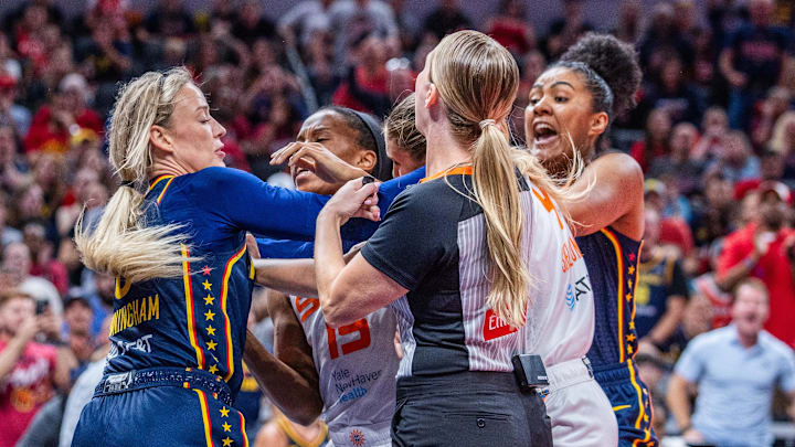 Indiana Fever guard Sophie Cunningham (8) and Connecticut Sun guard Jacy Sheldon (4) get into a fight in the second half at Gainbridge Fieldhouse.