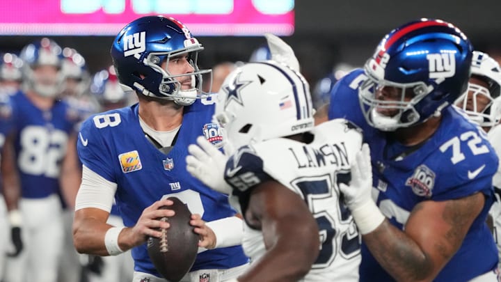 Sep 26, 2024; East Rutherford, New Jersey, USA;  New York Giants quarterback Daniel Jones (8) throws against the Dallas defense during the first half at MetLife Stadium. Mandatory Credit: Robert Deutsch-Imagn Images