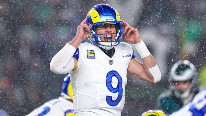 Jan 19, 2025; Philadelphia, Pennsylvania, USA; Los Angeles Rams quarterback Matthew Stafford (9) calls a play at the one of scrimmage against the Philadelphia Eagles in a 2025 NFC divisional round game at Lincoln Financial Field. Mandatory Credit: Bill Streicher-Imagn Images