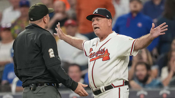 Sep 27, 2023; Cumberland, Georgia, USA; Atlanta Braves manager Brian Snitker (43) argues with and is ejected from the game by umpire Dan Bellino (2) after a play against the Chicago Cubs during the second inning at Truist Park. Mandatory Credit: Dale Zanine-Imagn Images
