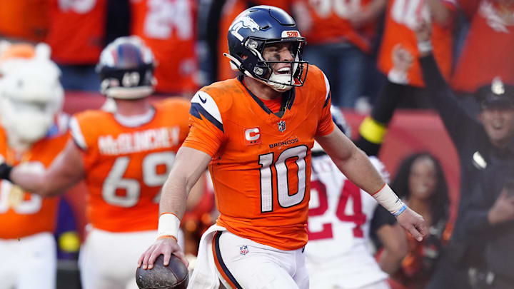 Oct 19, 2025; Denver, Colorado, USA; Denver Broncos quarterback Bo Nix (10) celebrates after play during the second half against the New York Giants at Empower Field at Mile High. Mandatory Credit: Ron Chenoy-Imagn Images