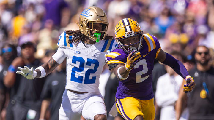 Sep 21, 2024; Baton Rouge, Louisiana, USA;  LSU Tigers wide receiver Kyren Lacy (2) misses a pass against UCLA Bruins defensive back Croix Stewart (22) during the first half at Tiger Stadium. Mandatory Credit: Stephen Lew-Imagn Images
