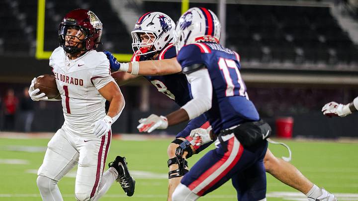 El Dorado’s Ryan Estrada carries the ball against Richland’s Gage Goodwin pushes Estrada out of bounds in a 5A D1 playoff game, Nov. 21, 2025, at the Jones AT&T Stadium in Lubbock. El Dorado’s Ryan Estrada carries the ball against Richland’s Gage Goodwin pushes Estrada out of bounds in a 5A D1 playoff game, Nov. 21, 2025, at the Jones AT&T Stadium in Lubbock.