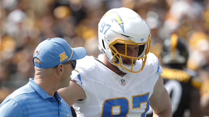 Sep 22, 2024; Pittsburgh, Pennsylvania, USA;  Los Angeles Chargers linebacker Joey Bosa (97) exits the field with a team trainer after suffering an apparent injury against the Pittsburgh Steelers during the first quarter at Acrisure Stadium. Bosa would not return. Pittsburgh won 20-10. Mandatory Credit: Charles LeClaire-Imagn Images