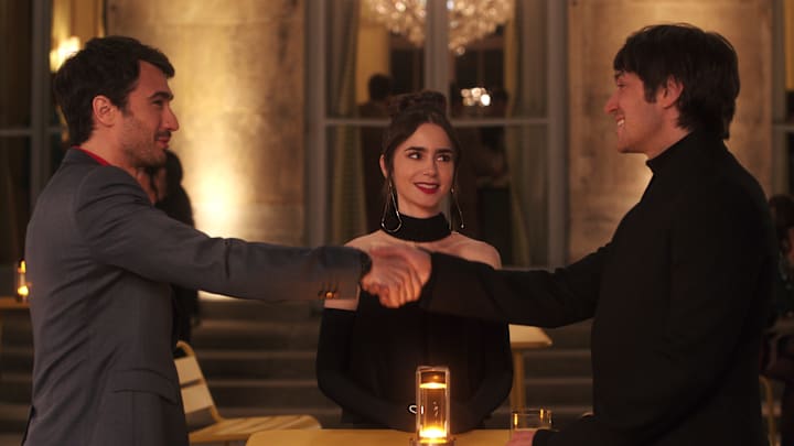 Emily in Paris. (L to R) Eugenio Franceschini as Marcello, Lily Collins as Emily, Lucas Bravo as Gabriel in episode 408 of Emily in Paris