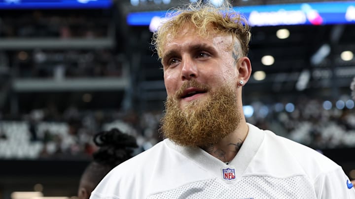 Boxer and influencer Jake Paul walks on the field before a game between the New Orleans Saints and Dallas Cowboys.