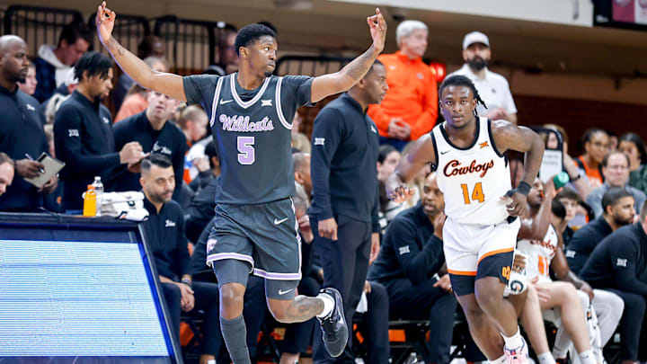 Kansas State guard Cam Carter (5) celebrates a 3-point play in the first half during K-State's game against Oklahoma State.