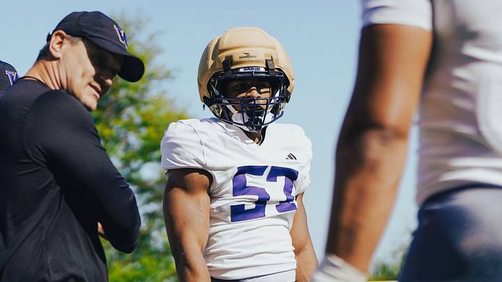 Brian Odom, left, surveys the UW linebacker situation. Brian Odom, left, surveys the UW linebacker situation.