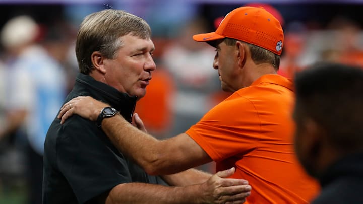 Georgia coach Kirby Smart and Clemson head coach Dabo Swinney speak before the start of the NCAA Aflac Kickoff Game in Atlanta, on Saturday, Aug. 31, 2024.