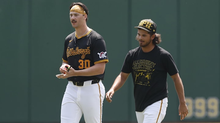 Pittsburgh Pirates pitchers Paul Skenes (left) and Jared Jones (right) walk in the outfield before the game against the Atlanta Braves at PNC Park. 