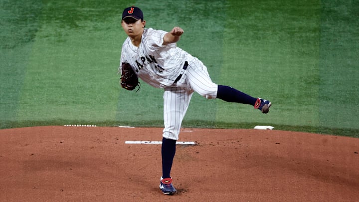 Mar 21, 2023; Miami, Florida, USA; Japan starting pitcher Shota Imanaga (21) pitches against the USA
