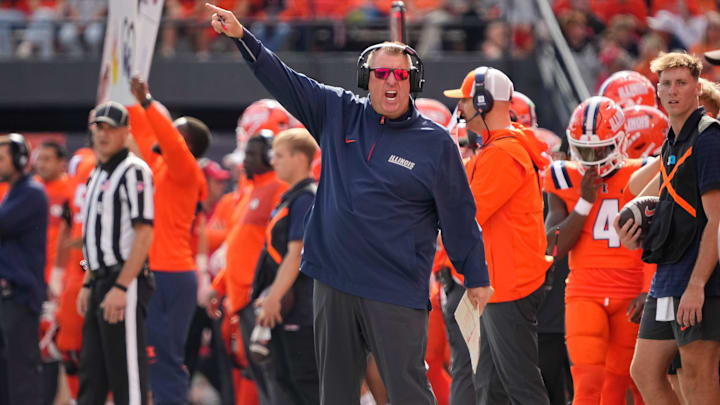 Illinois Fighting Illini head coach Bret Bielema motions during the first half of the NCAA football game against the Ohio State Buckeyes at Gies Memorial Stadium in Champaign on Oct. 11, 2025.