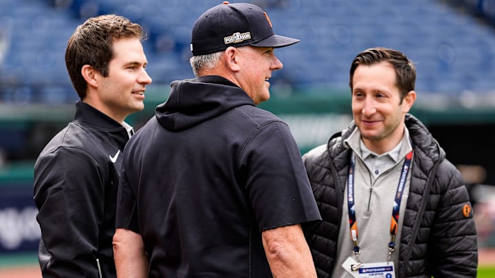 From left, Detroit Tigers president of baseball operations Scott Harris, talks to manager A.J. Hinch and general manager Jeff Greenberg before Game 2 of ALDS at Progressive Field in Cleveland, Ohio on Monday, Oct. 7, 2024.