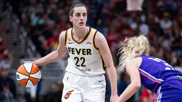 Jun 24, 2026; Indianapolis, Indiana, USA; Indiana Fever guard Caitlin Clark (22) dribbles the ball while Phoenix Mercury guard Lexi Held (10) defends in the second half at Gainbridge Fieldhouse. Mandatory Credit: Trevor Ruszkowski-Imagn Images