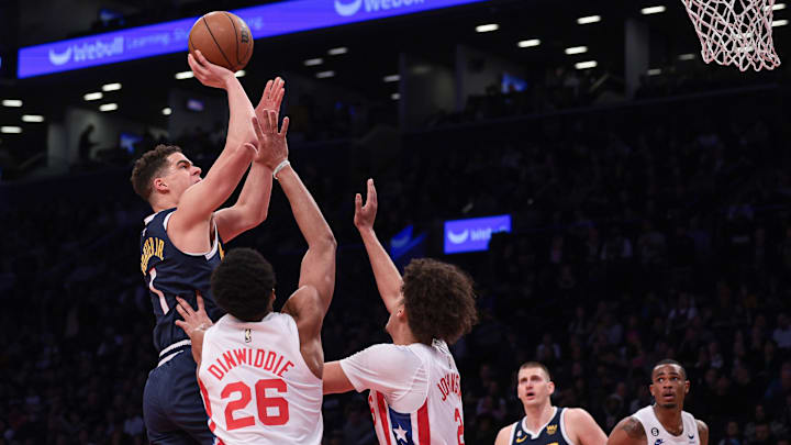 Mar 19, 2023; Brooklyn, New York, USA; Denver Nuggets forward Michael Porter Jr. (1) shoots the ball asBrooklyn Nets guard Spencer Dinwiddie (26) and forward Cameron Johnson (2) defend during the first half at Barclays Center. Mandatory Credit: Vincent Carchietta-Imagn Images Mar 19, 2023; Brooklyn, New York, USA; Denver Nuggets forward Michael Porter Jr. (1) shoots the ball asBrooklyn Nets guard Spencer Dinwiddie (26) and forward Cameron Johnson (2) defend during the first half at Barclays Center. Mandatory Credit: Vincent Carchietta-Imagn Images