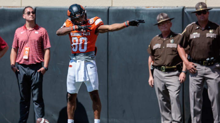 Sep 7, 2024; Stillwater, Oklahoma, USA; Oklahoma State Cowboys wide receiver Brennan Presley (80) signals first down during the fourth quarter against the Arkansas Razorbacks at Boone Pickens Stadium. Mandatory Credit: William Purnell-Imagn Images