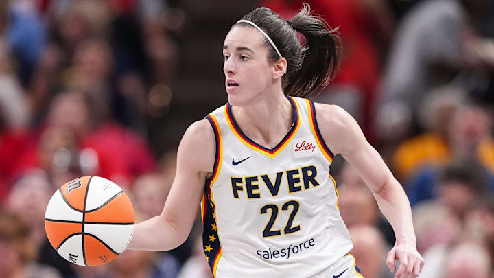 Indiana Fever guard Caitlin Clark (22) rushes up the court Friday, July 12, 2024, during the game at Gainbridge Fieldhouse in Indianapolis. The Indiana Fever defeated the Phoenix Mercury, 95-86.