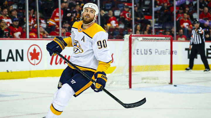 Jan 4, 2025; Calgary, Alberta, CAN; Nashville Predators center Ryan O'Reilly (90) scores a goal against the Calgary Flames during the third period at Scotiabank Saddledome. Mandatory Credit: Sergei Belski-Imagn Images