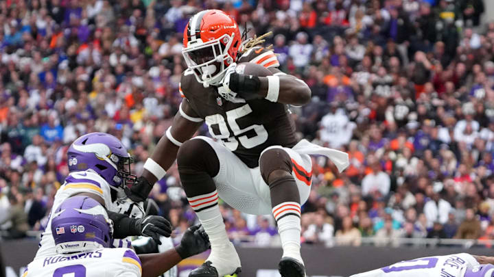 Oct 5, 2025; Tottenham, United Kingdom; Cleveland Browns tight end David Njoku (85) leaps over Minnesota Vikings linebacker Ivan Pace Jr. (0) during the third quarter of an NFL International Series game at Tottenham Hotspur Stadium. Mandatory Credit: Kirby Lee-Imagn Images