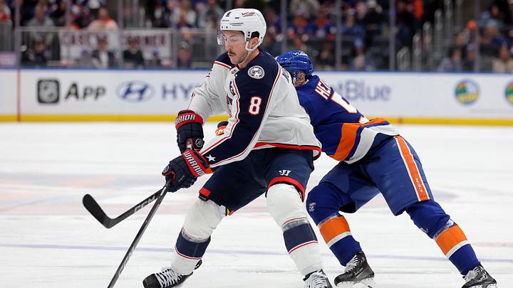 Mar 22, 2026; Elmont, New York, USA; Columbus Blue Jackets defenseman Zach Werenski (8) plays the puck against New York Islanders left wing Emil Heineman (51) during the first period at UBS Arena. Mandatory Credit: Brad Penner-Imagn Images Mar 22, 2026; Elmont, New York, USA; Columbus Blue Jackets defenseman Zach Werenski (8) plays the puck against New York Islanders left wing Emil Heineman (51) during the first period at UBS Arena. Mandatory Credit: Brad Penner-Imagn Images