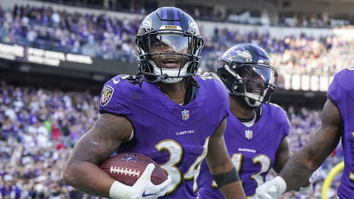 Nov 5, 2023; Baltimore, Maryland, USA;  Baltimore Ravens running back Keaton Mitchell (34) celebrates his touchdown against the Seattle Seahawks during the third quarter at M&T Bank Stadium. Mandatory Credit: Jessica Rapfogel-Imagn Images