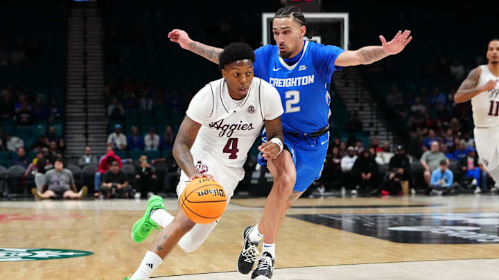 Texas A&M Aggies guard Wade Taylor IV (4) dribbles against Creighton Bluejays guard Pop Isaacs (2) during the first half at MGM Grand Garden Arena.