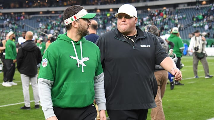 Sirianni and DiSandro coming off the field after a game, with the Italian flag visible on Sirianni’s visor.