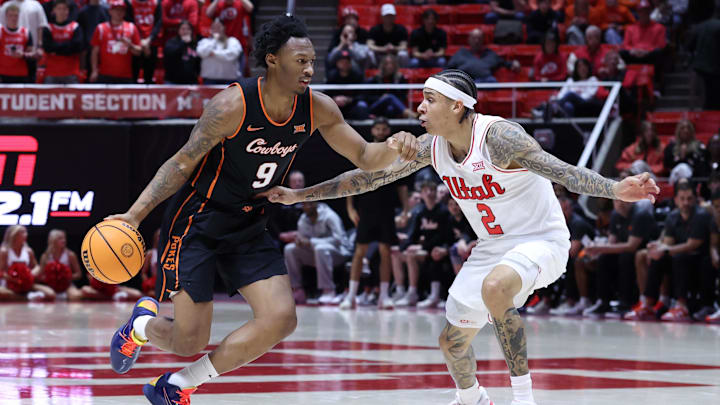 Jan 31, 2026; Salt Lake City, Utah, USA; Oklahoma State Cowboys guard Anthony Roy (9) moves the ball against Utah Utes guard Terrence Brown (2) during the first half at Jon M. Huntsman Center. Mandatory Credit: Rob Gray-Imagn Images Jan 31, 2026; Salt Lake City, Utah, USA; Oklahoma State Cowboys guard Anthony Roy (9) moves the ball against Utah Utes guard Terrence Brown (2) during the first half at Jon M. Huntsman Center. Mandatory Credit: Rob Gray-Imagn Images