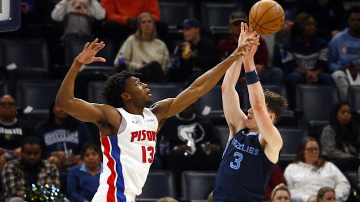 Apr 5, 2024; Memphis, Tennessee, USA; Detroit Pistons center James Wiseman (13) blocks the shot attempt of Memphis Grizzlies forward Jake LaRavia (3) during the second half at FedExForum. Mandatory Credit: Petre Thomas-Imagn Images